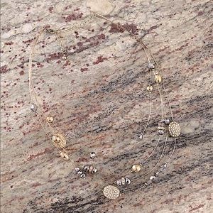 Layered wire necklace with beads and charms